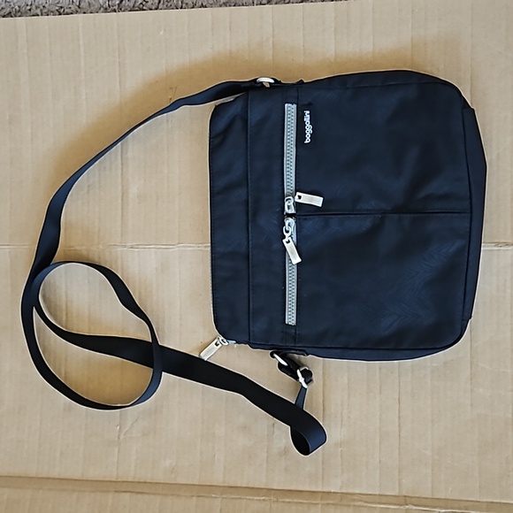 Baggallini Handbags - Baggallini Comrade black zebra embossed crossbody bag